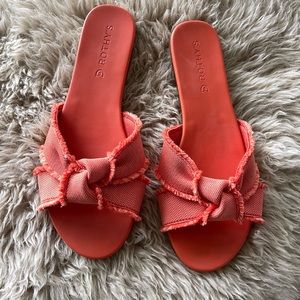 Rothy’s orange fringe knot slide Sandal